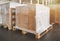 Packaging Boxes Wrapped Plastic Film on Pallets Rack in Storage Warehouse. Supplies. Storehouse Cargo Shipment. Warehouse Shipping