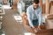 Packaging the wooden sheets. Print house worker in white clothes is indoors