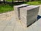 Packed concrete paving slabs are on a wooden pallet for road repair