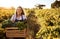 Packed full of green goodness. Cropped portrait of an attractive young woman holding a crate full of freshly picked