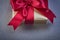 Packed present box with red ribbon on grey background holidays c