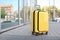 Packed yellow carry on suitcase