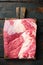 Packer brisket, raw beef brisket meat, on old dark  wooden table background, top view flat lay