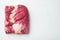 Packer brisket, raw beef brisket meat, on white stone  background, top view flat lay,  with copy space for text
