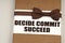 On the packing box with a bow-tie the inscription - Decide Commit Succeed