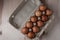 Packing chicken eggs on a wooden background