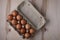 Packing chicken eggs on a wooden background