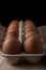 Packing chicken eggs on a wooden background