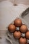 Packing chicken eggs on a wooden background close up