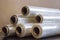 Packing material. Many rolls of stretch film are white transparent. Polymer product for wrapping.