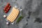 Packing sausages, on gray stone table background, top view flat lay, with copy space for text