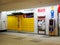 Paczkomat InPost, yellow parcel locker, Krakow main train station, shopping mall. Simple self service mail package locker machine