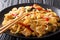 Pad Kee Mao is a traditional Thai dish with chicken, wide rice noodles and plenty of fresh basil in a spicy, sweet and tangy rich