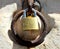 pad lock of love or padlock of love closed in an ancient rusty iron ring used to tie horses to the wall positioned by lovers to s