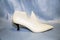 Pad for molding the upper of shoes in white on a background of genuine leather in blue. Technologies public service