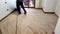 pad sander sanding hardwood floor