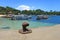 Padang Bai beach with traditional outrigger boats in Bali, Indonesia.