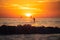 Paddle boarding during a beautiful sunrise. Panoramic view of sunset over ocean. Beautiful serene scene. Sea sky concept