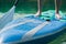 Paddle boarding closeup on pure aquamarine water. surfer feet closeup