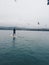 Paddle-boarding in a harbor surrounded by seagulls