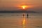 Paddle boarding at sunset