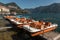 Paddle boats moored on lake Lugano