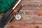 Paddle fishing rod and fishing net on a wooden background top view. Fishing hobby vacation concept. Copy space