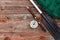 Paddle fishing rod and fishing net on a wooden background top view. Fishing hobby vacation concept. Copy space