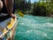 Paddle, river and the side of the boat during rafting