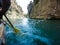 Paddle, river and the side of the boat during rafting