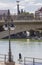 Paddle surfer under Triana Bridge of Seville, Spain