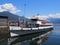 Paddle-wheel steam boat moored ready to cruise at promenade on alpine Maggiore Lake in Locarno at Switzerland