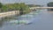 Paddle wheels aerators in black water on canal.