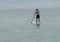 Paddleboarder near the beach toward the horizon at Emerald Isle, North Carolina