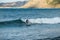 Paddleboarder riding a wave at Losari in Corsica