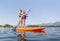 Paddleboarding on scenic mountain lake low angle view