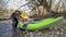 Paddler with whitewater inflatable kayak