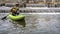 Paddler with whitewater inflatable kayak