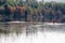 Paddlers.in the morning light on Grand Lake in Algonquin Park in autumn