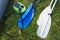 Paddles and pump for kayaks on the river bank. Oars for a boat, canoe or kayak.