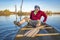 Paddling canoe on calm lake