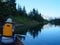 Paddling at dusk on a mountain lake