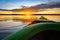 Paddling a sea kayak at sunset, calm water