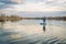 Paddling stand up paddleboard on a calm lake
