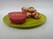 Paddu or Kuzhi paniyaram and Coconut Chutney in a Green Plate isolated on White Background. Indian dish made by steaming batter