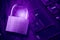 Padlock on computer motherboard and keyboard. Internet data privacy information security concept. Ultraviolet toned image