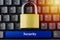Padlock on keyboard with blue space button and SECURITY inscription on it. Internet data privacy information security concept