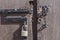 Padlock and metal rings on unlocked rustic wooden door