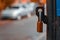 The padlock still hanging on the open gate