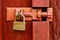 Padlock on wooden door